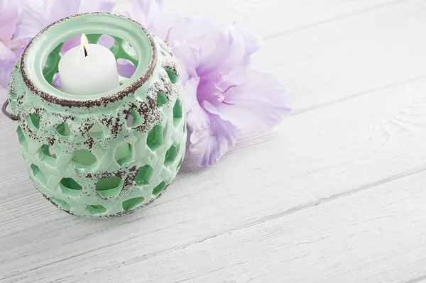 Mint green candlelight and purple flowers