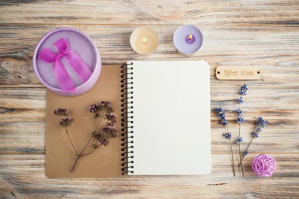 Notebook, lavender flowers, candles