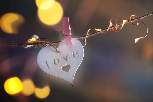 White wooden heart and lights — Stock Photo, Image