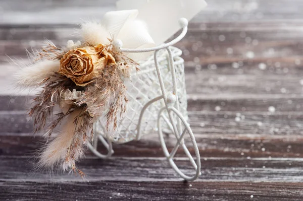 Bouquet of dry flowers on decorative bike — 스톡 사진