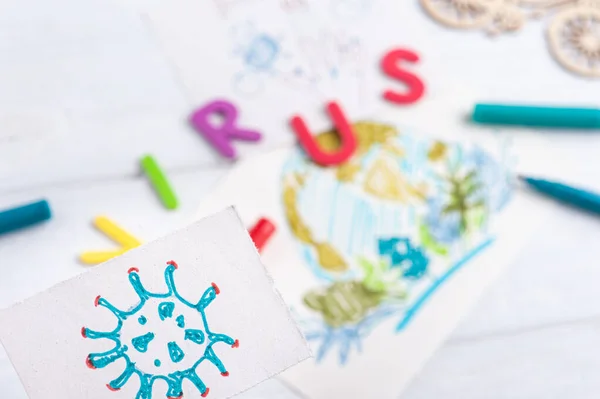 Child drawing of Coronavirus closeup with earth on background. Concept of virus protection and coping