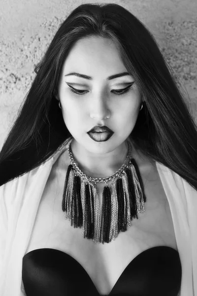 Black and white photo of model with long hair, bright make-up and accessories — Stock Photo, Image