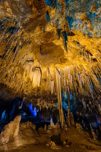 Up risen angle view of Stalactite stalactites with color lighting — Stock Photo, Image