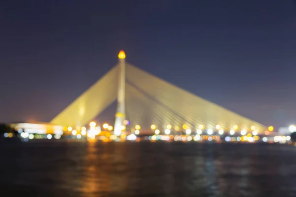 Blur of Big Suspension bridge with lighting in night time / Rama 8 bridge in night time