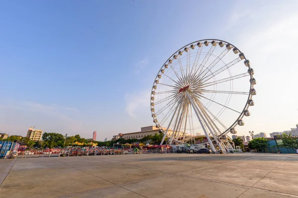 Ferris wheel at carnival park in sunset time