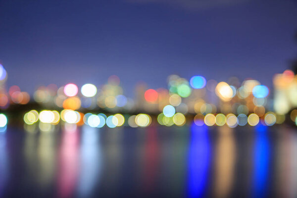 Blur of bokeh city reflection for background