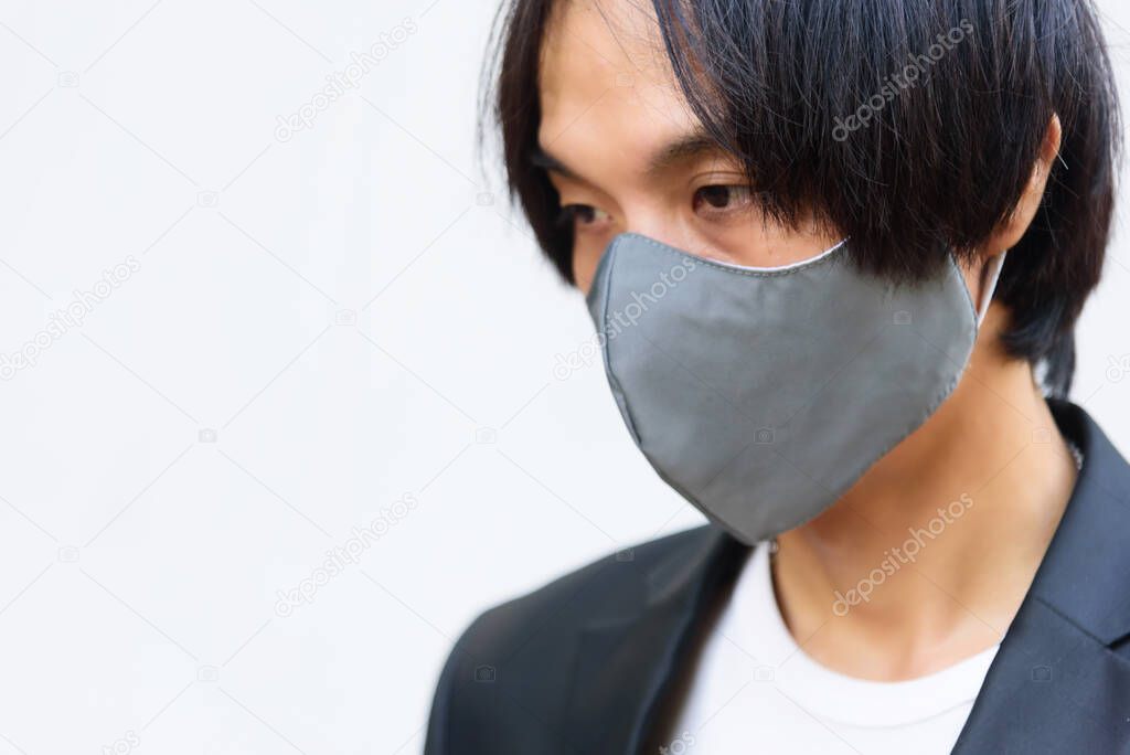 Asian man wear cloth mask for protect from covid-19 / cloth mask 