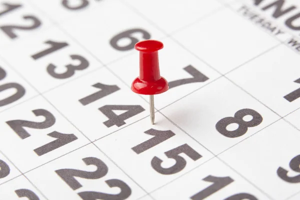 Day 15 marked on the calendar with a red thumbtack