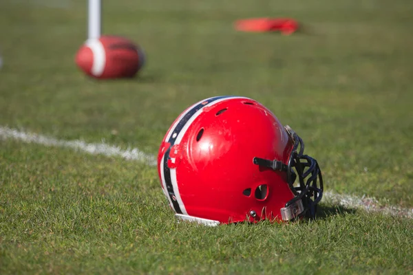 american football helmet on the playing field