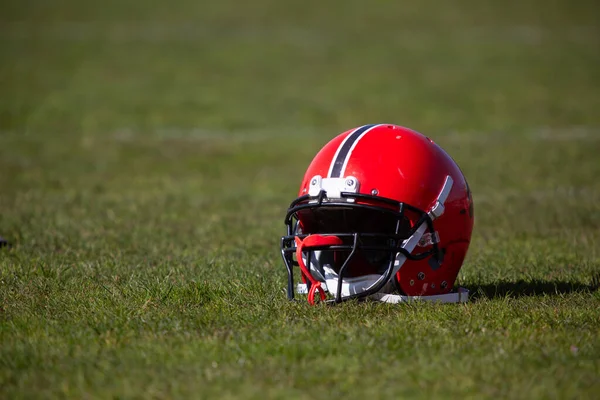 american football helmet on the playing field