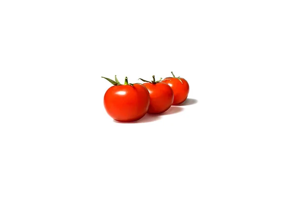 Three red tomatoes on a white background — Stock Photo, Image