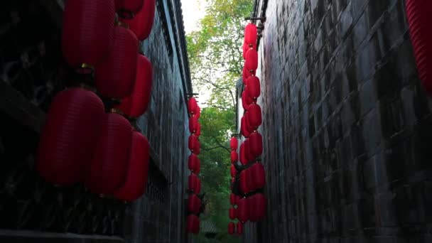 Walking Narrow Corridor Ancient Walls Chinese Temple Lanterns Hanging Roof — Stock Video