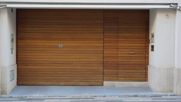 elegant front door of an urban residential house made of wood