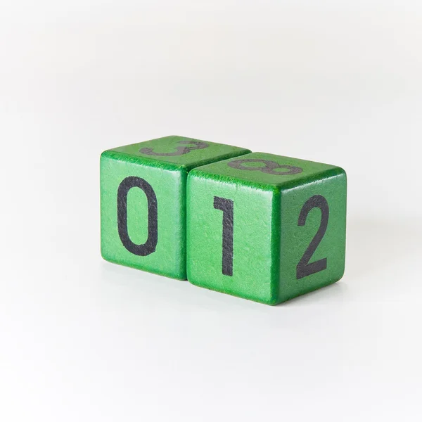 Number one written on a wooden green cube — Stock Photo, Image