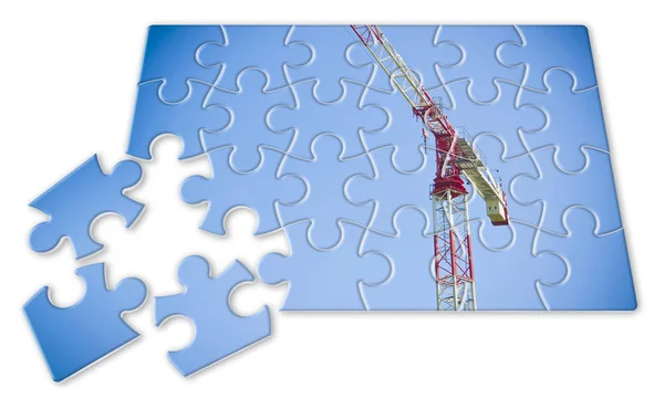 Żuraw wieżowy na niebieskim tle w kształcie puzzle-Concept — Zdjęcie stockowe