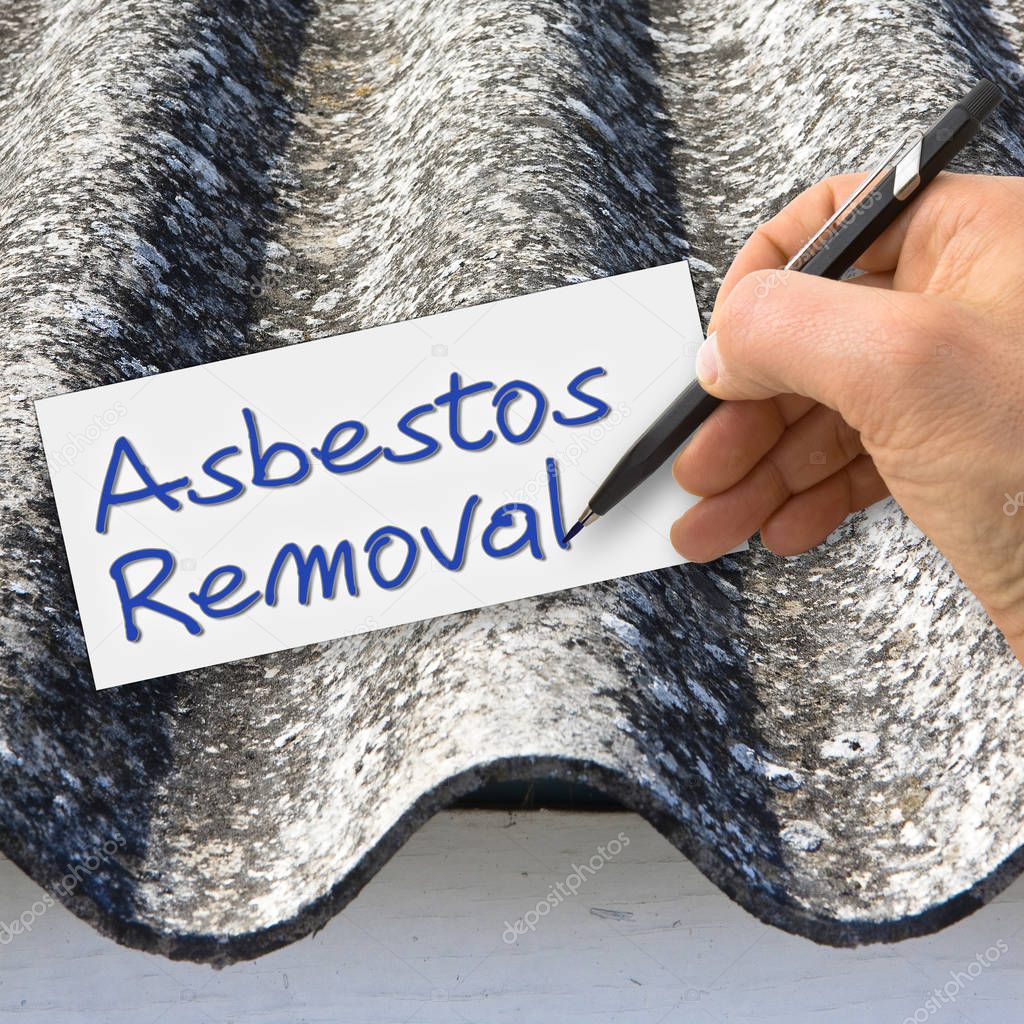 Hand writing Asbestos Removal with a pencil on a white sheet - c