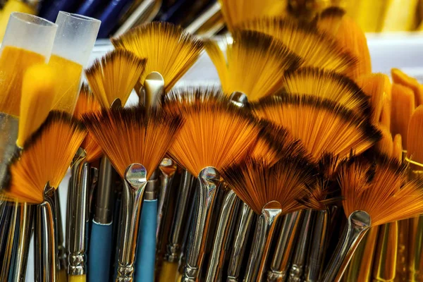 Close-up of fan-shaped paint brushes, selective focus — Stock Photo, Image