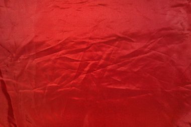 Buruşuk kırmızı kumaş, soyut kırmızı arkaplan, üst görünüm