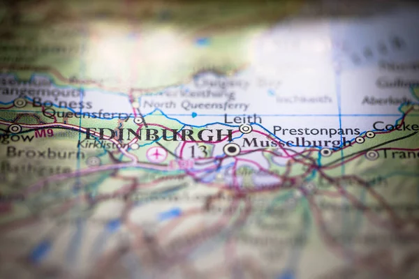 Shallow depth of field focus on geographical map location of Edinburgh city in Scotland United Kingdom Europe continent on atlas