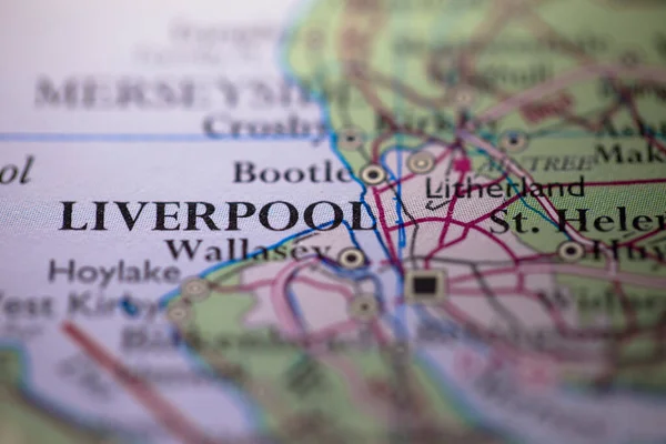 Shallow depth of field focus on geographical map location of Liverpool city in England United Kingdom Europe continent on atlas
