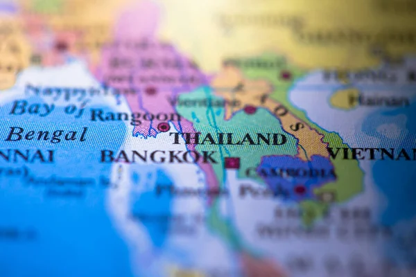 Shallow depth of field focus on geographical map location of ancient country Siam Thailand in Asia continent on atlas