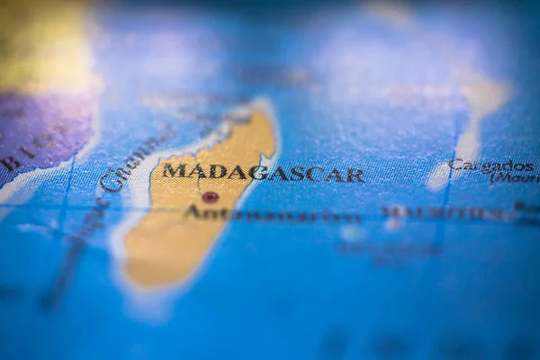 Shallow depth of field focus on geographical map location of country Madagascar in Africa continent on atlas