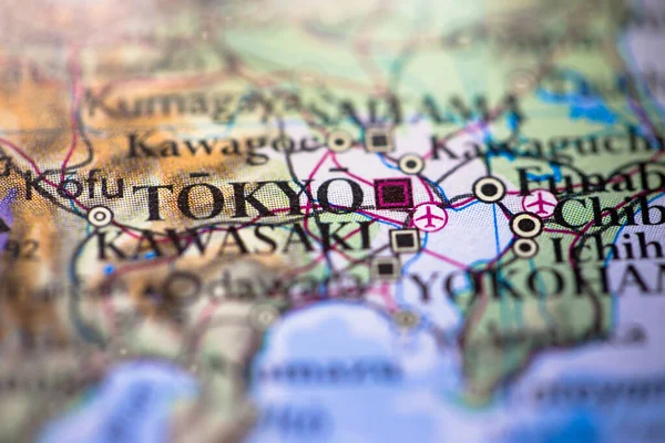 Shallow depth of field focus on geographical map location of Tokyo city in Japan Asia continent on atlas