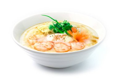 Congee Shrimps, Rice Lapa ile haşlanmış yumurta zencefil ve pirzola, kişniş thai otu servis edildi. Asya Yemekleri kahvaltısı oyulmuş havuçlar ve taze soğan manzarasıyla süslenir.