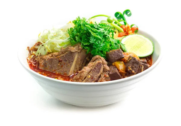 Thai Rice Noodles ,vermicelli rice small noodles and with spicy pork sauce. Northern Thai food made of rice noodle in spicy sauce with pork or meat decorate with carved chili and spring onions side view
