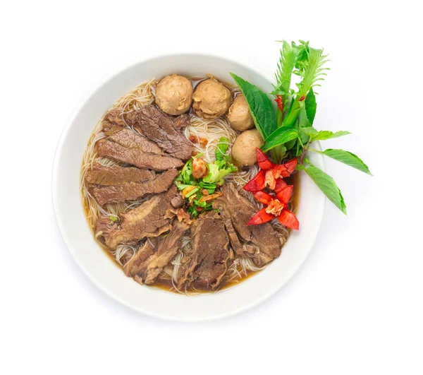 Vermicelli Noodles with Braised Stewed Beef in Chinese herbs soup (kuay taiw nuae toon) Thai food dish decorate with vegetables style