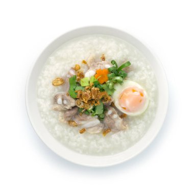Rice Porridge with Pork Cartilage or Soft Spareribs Pork and Boiled Egg ontop spring onions,carrot and Celery cutlet is a classic Boiled Rice Food Asian breakfast dish made by boiling rice in a great deal of water clipart