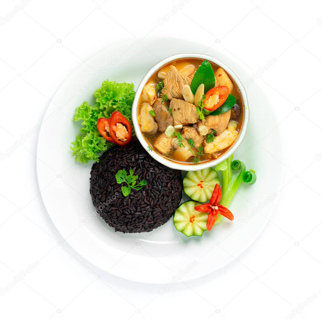 Spicy Chicken Soup Tom Yum style Served Riceberry Rice Thai Food Fusion Healthy Cleanfood  and Dietfood Cooked Low Sodium Goodtasty decorate with carved vegetables topview