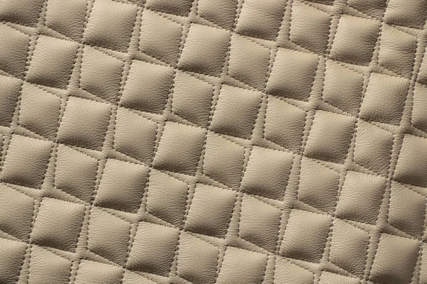 Texture of a piece of quilted leather