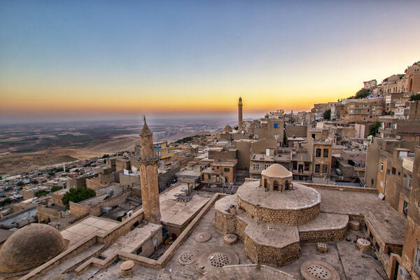 Mardin landscape beautiful sunset with clouds Turkey. With minarets is best touristic destination of Mardin.