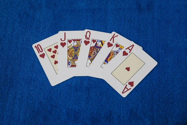 poker game with cards and chips on a blue background