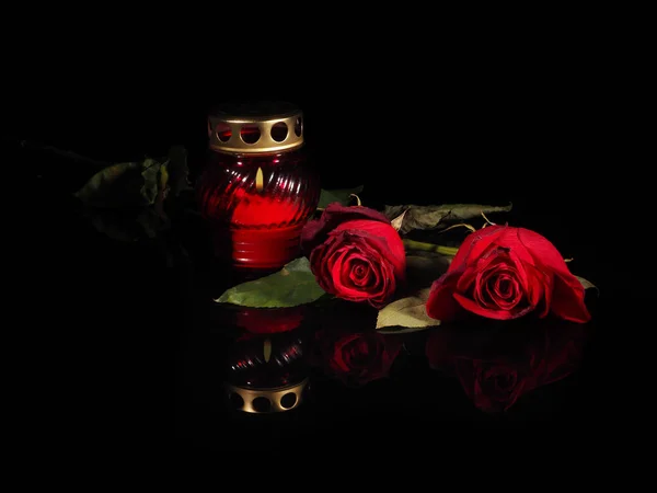 Burning candle in a red glass candlestick — Stock Photo, Image