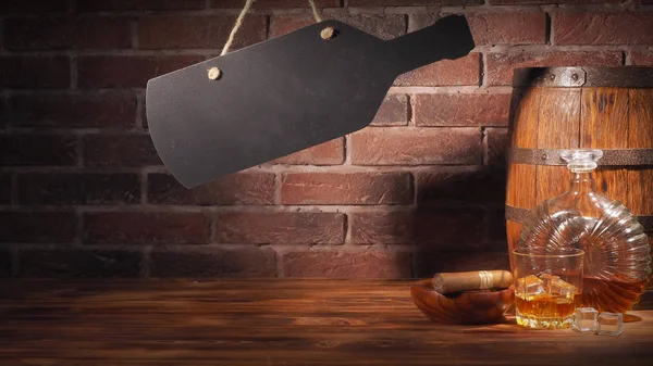 Glass of cognac with barrel on brick backgroun — Stock Photo, Image