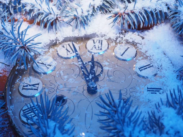 Frozen clock on New Year\'s background. Christmas concept.