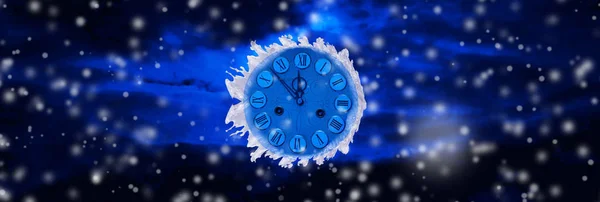 Frozen clock on New Year\'s background. Christmas concept
