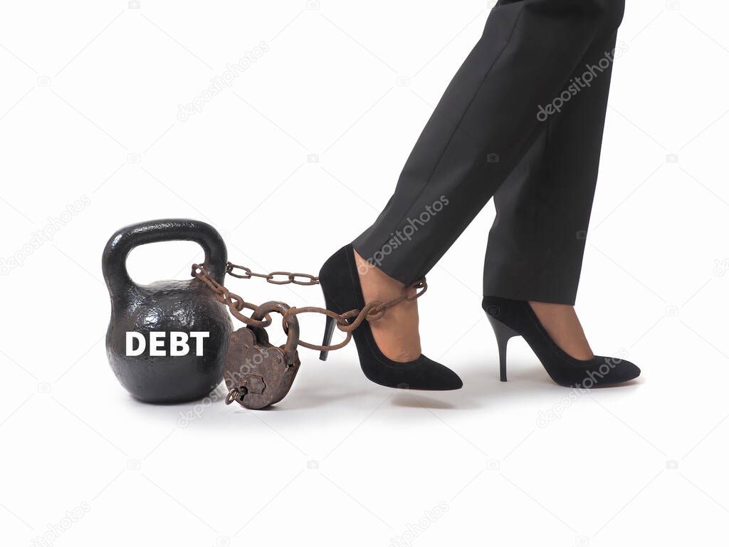 Woman's legs with chains and weights. The debt concept .