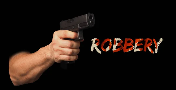 Gun in a man hand. The concept of robbery, violence, fear, security, crime.