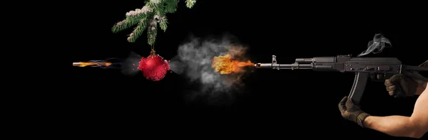 Freezing shot of a gun and Christmas on black background. Concept gun club, gun-shop, shooting range.