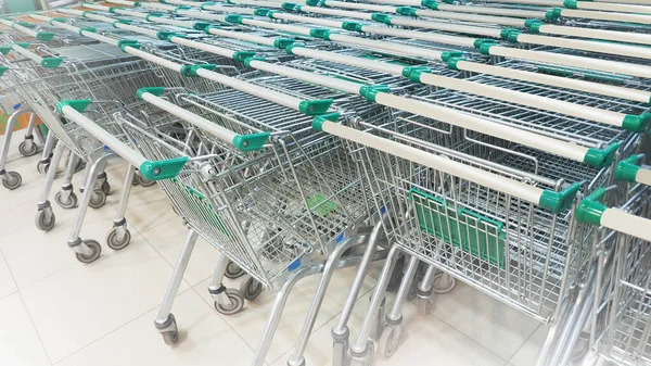 Large group of shopping carts in the background