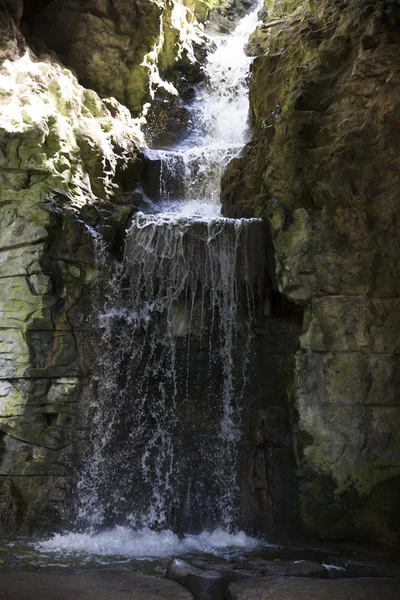 the stream flowing in deepening rock falls from the height to th