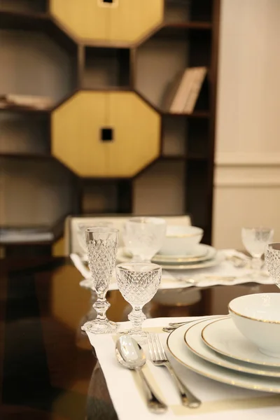 Brown table, which served for two  porcelain plates and wine gla — Stock Photo, Image