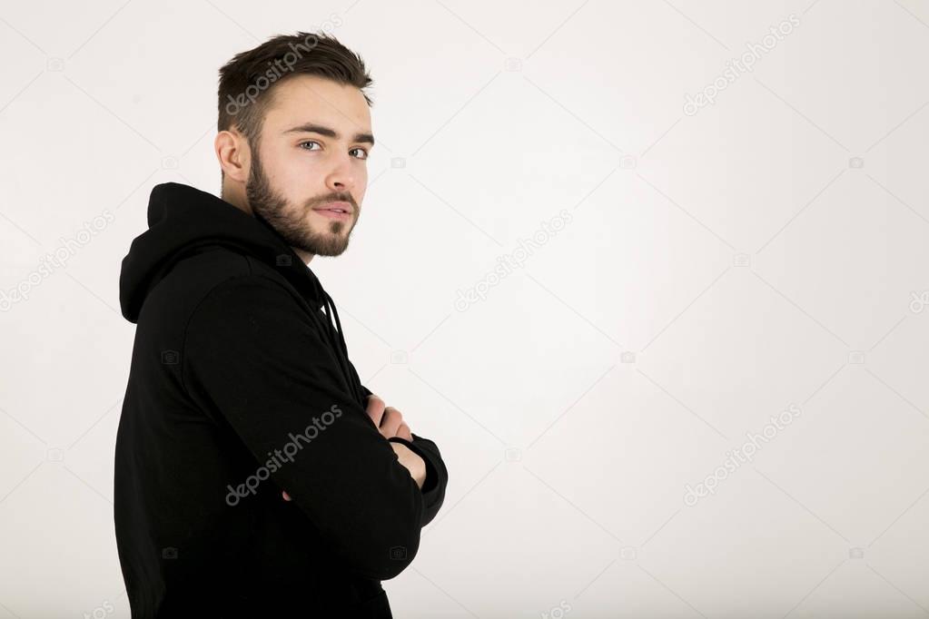 a stylish attractive young man with a small beard in black clot