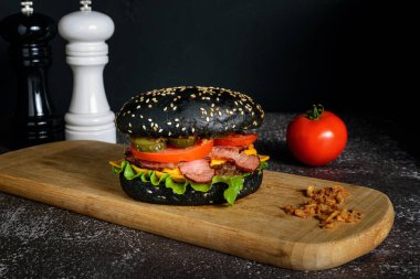 Black hamburger made from beef, with jalapeno pepper clipart