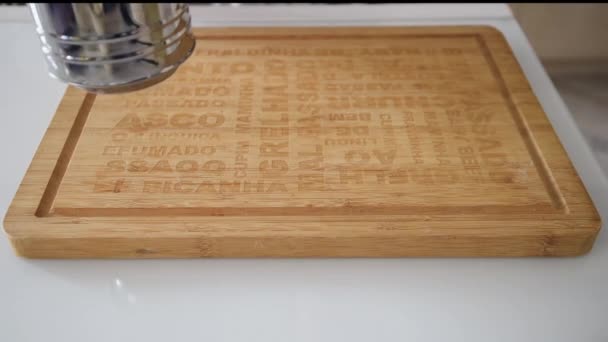 Sifting flour on a wooden board — Stock Video