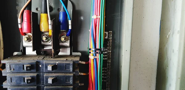 Black electrical circuit switch breaker with bush bar and wiring line, newton, ground and signal cable in main control box - Industrial, Distribute electricity and Installation concept