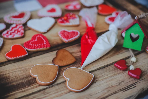Red heart cookies on wooden background Valentines day